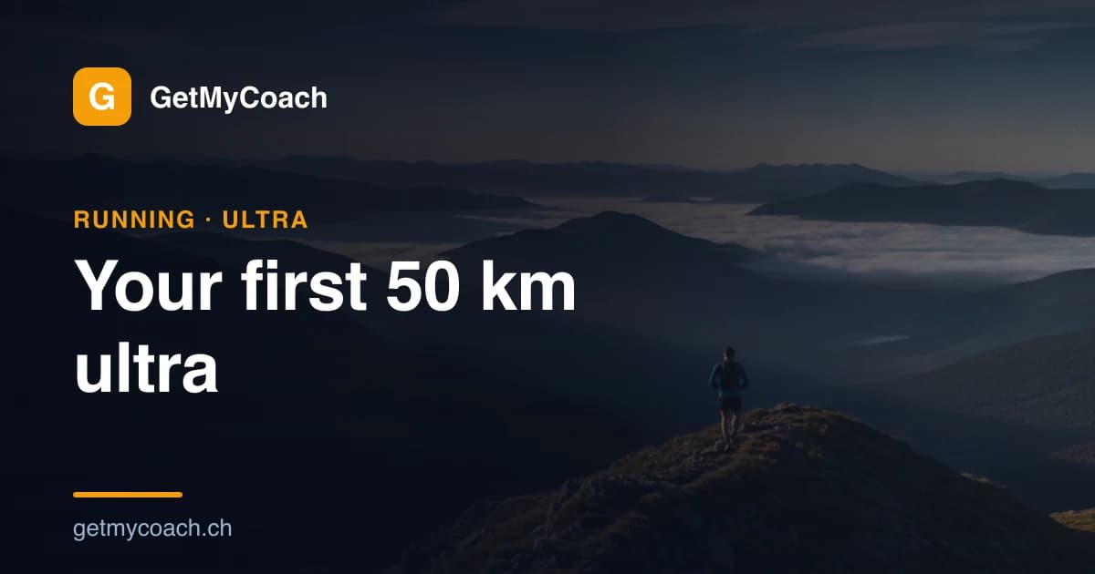 A single trail runner moving along an exposed mountain ridge path in early-morning light, with a long valley falling away below — cover image for the GetMyCoach guide to training for a first 50 km ultramarathon.