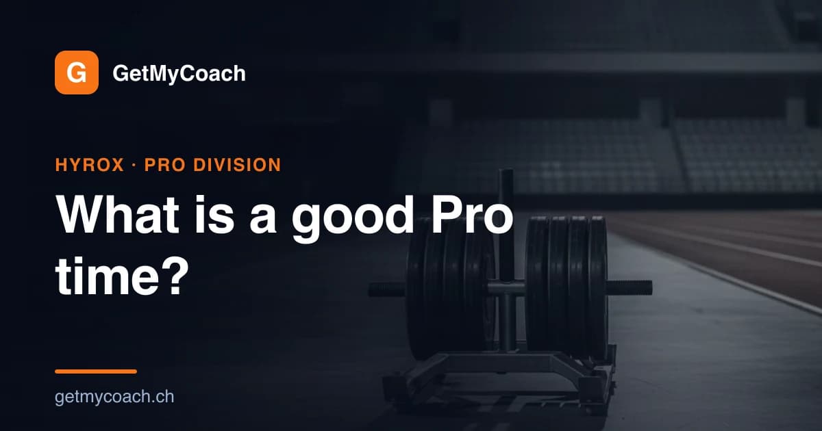 A competition sled stacked with heavy black plates standing on the floor of a floodlit indoor race arena in front of empty grandstands — cover image for the GetMyCoach guide to Hyrox Pro division finish times.