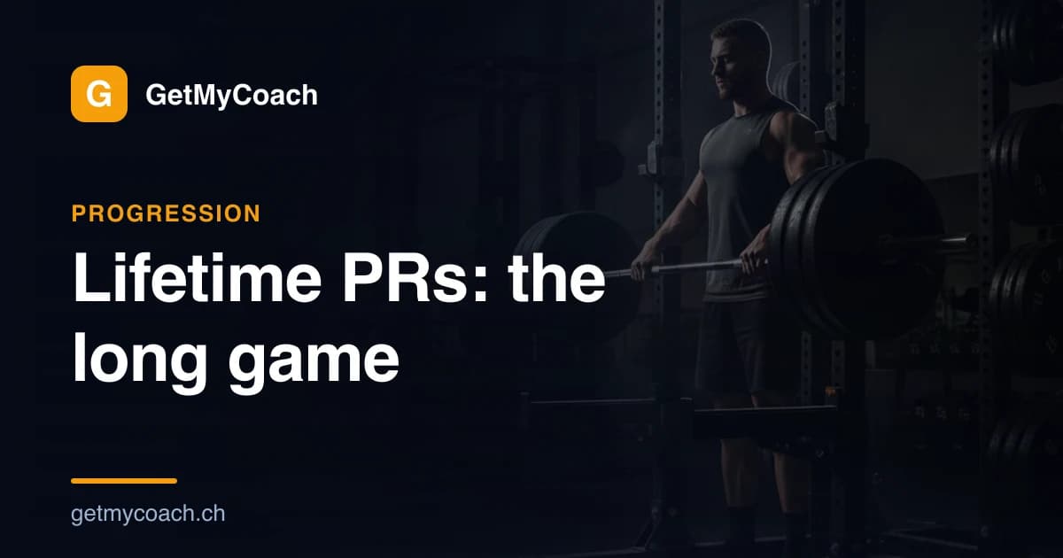 A loaded barbell resting in a squat rack under dramatic gym lighting — GetMyCoach cover graphic for the article on lifetime PRs and all-time personal records.