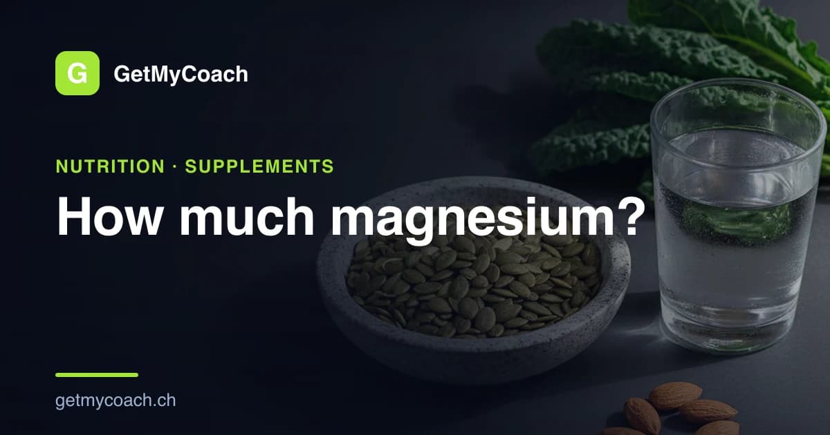 A stone bowl of pumpkin seeds beside a plain glass of water, dark leafy greens and a few almonds on a dark surface — cover image for the GetMyCoach guide to magnesium in sport.