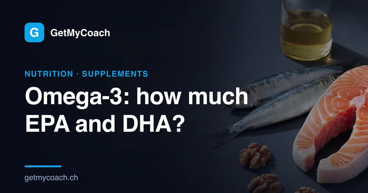 A raw salmon steak, two whole sardines, a small bottle of pale golden oil and a few walnut halves on dark slate — cover image for the GetMyCoach guide to omega-3 dosage in sport.